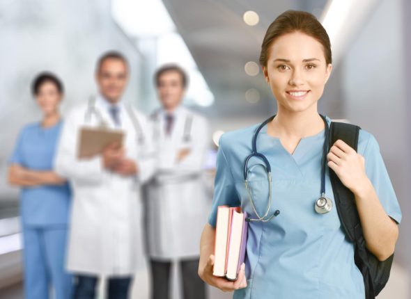 nurse-student-with-books-stethoscope-with-blurred-hospital-interior-background