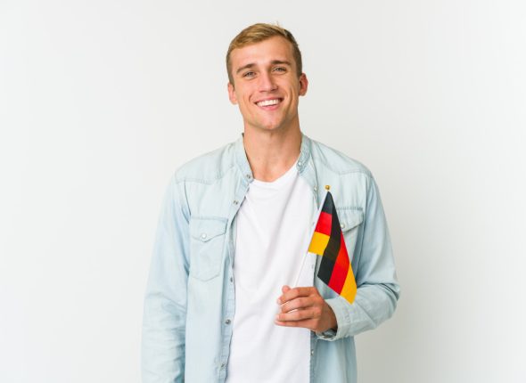 young-caucasian-man-holding-german-flag-white-feels-proud-self-confident-example-follow